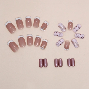 French tip press-on nails set with aurora heart patterns and rhinestone accents