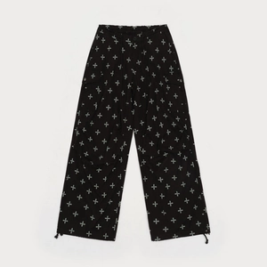 Paratrooper pants with black garden print, wide-leg cut and adjustable drawstring hem