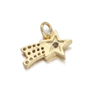 Macro shot of gold star-shaped pendant with sparkling inlaid round gemstones
