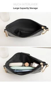 Detail of black pebbled leather crossbody bag showing large capacity for essentials