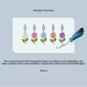 Detailed view of UV light-sensitive resin rose charms with sparkling zircon-set clasps