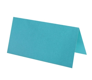 Detail of teal blue paper tent card showing matte texture and V-shape fold for seating