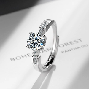 Sparkling zircon open ring with large round solitaire and pave-set silver band