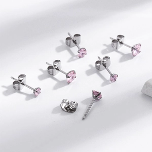 Pink round cubic zirconia stud earrings in polished stainless steel for women