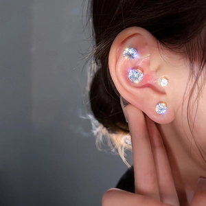 Sparkling silver magnetic zircon stud earrings shown on various ear positions