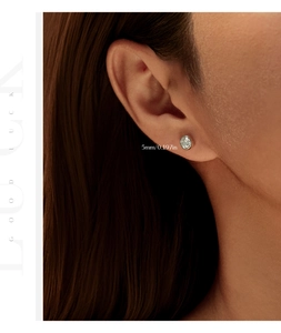 Close-up of 2 carat moissanite stud earring on ear with 5mm diameter dimension detail