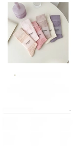 Detailed close-up of hollow out cotton crew socks in pastel Morandi colors for women