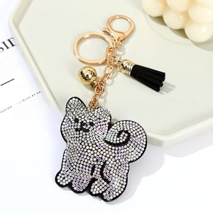 Close-up of sparkling crystal shiba inu keychain with elegant black tassel and gold plating