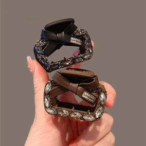Elegant square shark clip with leather bow and crystals for sophisticated hairstyling