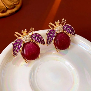 Vintage beetle stud earrings with deep red and purple enamel and sparkling white crystals