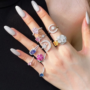 Detailed shot of S925 silver rings with colorful heart and flower zircon stones