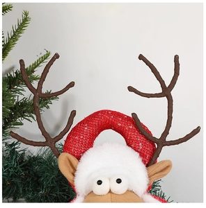 Close-up of a festive Christmas reindeer headband with red sequins and soft plush details