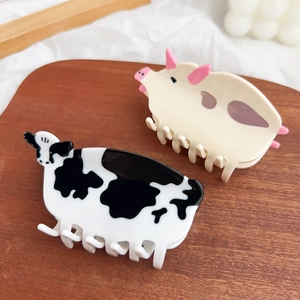Cute animal acetate hair claws featuring black cow pattern and pink pig shapes