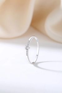 Detailed close-up of S925 sterling silver ring with water-drop zircon on silk backdrop