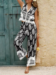 Detail shot of bohemian print two-piece set with lace trim against a rustic green door