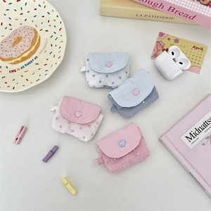 Star pattern fabric AirPods case in pink and blue with heart button closure for storage