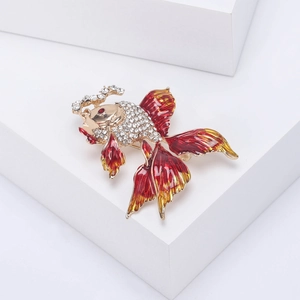 Detail of goldfish brooch with clear rhinestones and red-orange enamel finish
