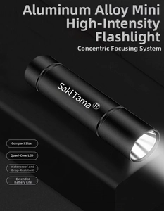 Close-up of a black aluminum mini LED flashlight with Saki Tama logo and textured grip