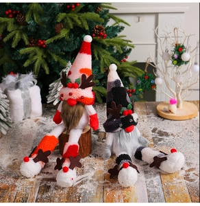 Detail of Christmas gnomes with knit hats, long legs, and soft sequined fabric textures