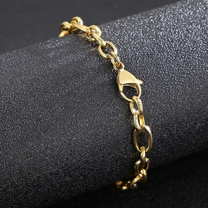 Macro shot of gold stainless steel link chain with a secure lobster clasp closure