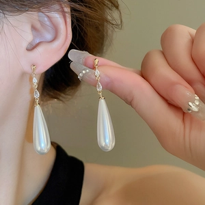 Elegant gold-plated drop earrings featuring teardrop faux pearls and zircon accents