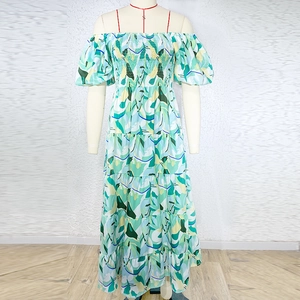 Detail of puff sleeve and floral pattern on off-shoulder long dress for summer