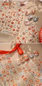 Detail of 3D embossed rabbit nail art stickers with festive red and gold New Year designs