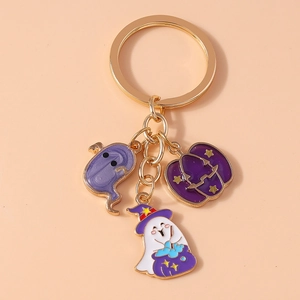 Detail of Halloween ghost and pumpkin charms with gold keychain and enamel finish