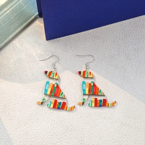 Acrylic dog-shaped earrings with colorful book stack patterns and silver hooks