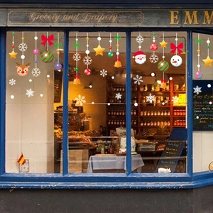 Christmas window decals with Santa Claus, elk, and snowflakes for store holiday decoration