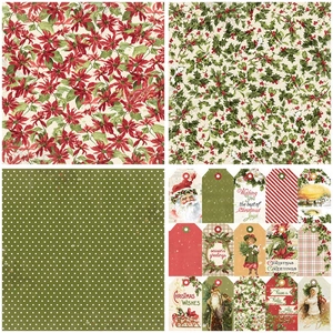 Detailed view of vintage Christmas scrapbook paper with poinsettia and holly berry patterns