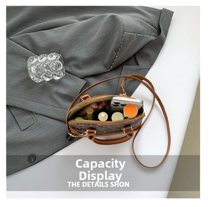 Interior view of leopard print shell bag showing storage space for phone and makeup