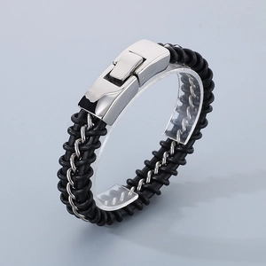 Detail of black braided leather bracelet with silver stainless steel magnetic clasp