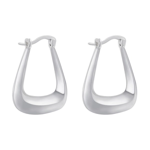 Detailed macro view of silver-toned U-shaped geometric earrings with polished mirror finish