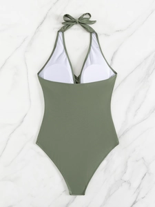 Inside view of olive green swimsuit showing white lining and built-in bra pads