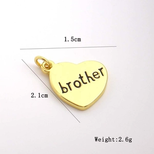 Detailed size view of a heart-shaped golden pendant with 'brother' engraving