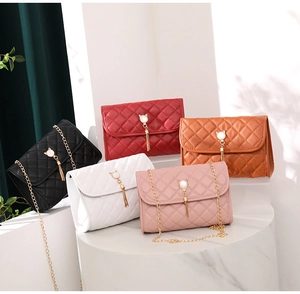 Quilted crossbody bags in five colors with pearl cat charm and golden chain straps