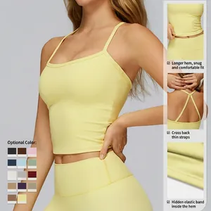 Women's yellow yoga tank top with cross back straps and supportive longline hem