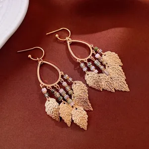 Bohemian gold leaf tassel earrings with water drop frames and vintage beaded accents