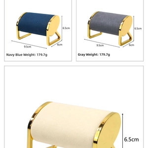 Detail of velvet pillow and gold metal frame for watch and bracelet jewelry display stand