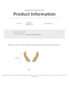 Detailed view of wheat-shaped earrings with sparkling zircon stones and white faux pearls