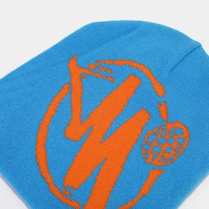 Detailed view of Klein blue knit beanie with orange jacquard street style pattern