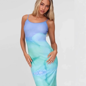 Detail of slim fit backless midi dress featuring a blue gradient watercolor print design