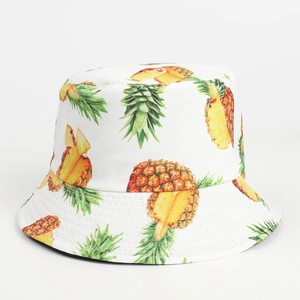 Detailed view of reinforced stitching on brim and tropical pineapple print on bucket hat
