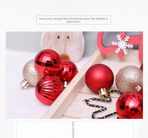 Detailed view of red and gold Christmas ball ornaments with varied textures on a wooden tray