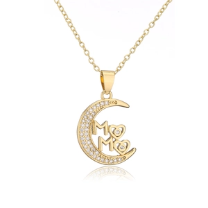 Detailed view of an 18K gold plated moon pendant with MAMA lettering and heart design