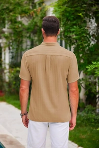 Close-up back view of khaki striped cotton linen shirt with vertical textured fabric