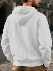 Rear view of white men's hoodie showing intricate diamond jacquard texture and ribbed hem