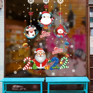 Christmas window decals with Santa Claus reindeer and snowmen on glass window display