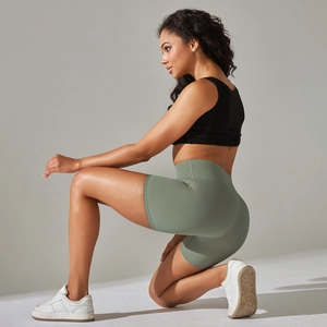 Detailed side view of high-waist yoga shorts in sage green with seamless push-up design
